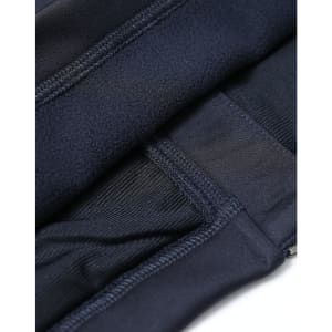 A close-up of a navy women's sustainable softshell corporate jacket, highlighting its stitching and fabric texture.
