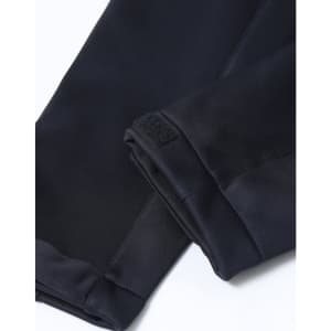 A close-up of the cuffs of a black ladies' sustainable softshell corporate jacket with a velcro detail.