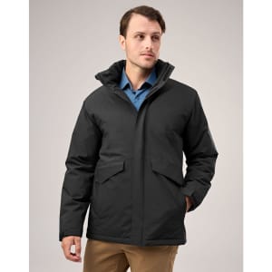 A black unisex quilted waterproof jacket with a hood and front pockets, worn by a model.