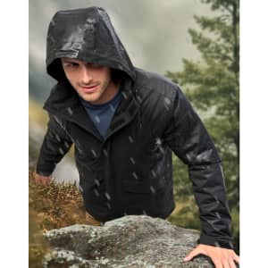 A unisex quilted waterproof jacket in black, featuring a hood, worn by a person outdoors.
