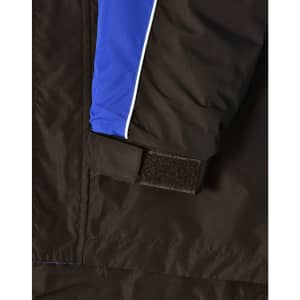 A close-up of a unisex jacket featuring black fabric with blue and white accents and a Velcro detail.