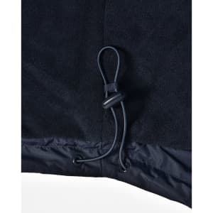 A close-up of a navy unisex jacket featuring a drawstring at the hem and a smooth fabric texture.