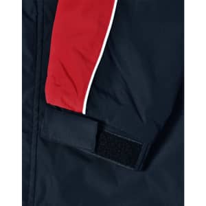 A unisex jacket featuring a navy body with red and white accents and a Velcro fastening on the sleeve.
