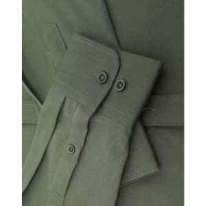 A close-up of a men's smart casual cotton blend long-sleeve shirt in olive green, featuring button details and cuffs.