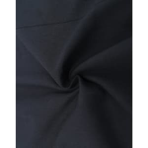 A close-up of a black cotton blend fabric showing its texture and smoothness, featuring a subtle swirl pattern.