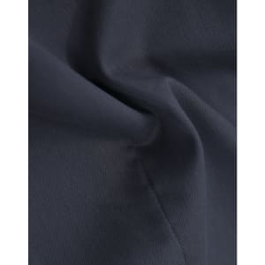 A close-up of navy cotton blend fabric, highlighting a textured weave with subtle folds.