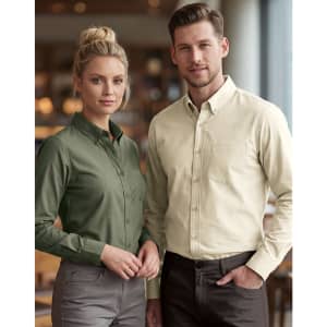A men's smart casual long-sleeve shirt in cream, alongside a women's shirt in olive green, both with a logo.