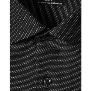 A close-up of a black pin dot stretch button-up shirt, featuring a collar and a single button.
