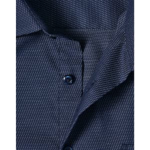 A close-up of a navy blue men's button-up shirt featuring a pin dot pattern and a collar with buttons.