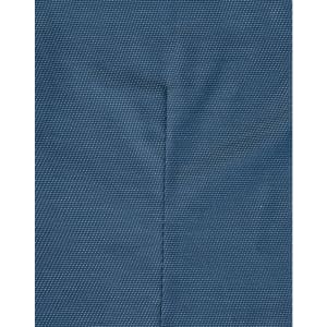 A close-up of a blue pin dot fabric, displaying subtle texture and stitching details typical of a long-sleeved button-up shirt.