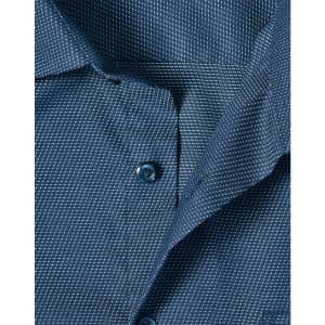 A close-up of a navy blue men's button-up shirt featuring a pin dot pattern and blue buttons.