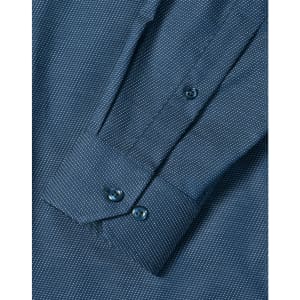 A blue men's long sleeve button-up shirt featuring a pin dot pattern and buttoned cuffs.