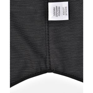 A black pin dot stretch short-sleeve shirt with a care label and a subtle pattern. Features a logo on the label.