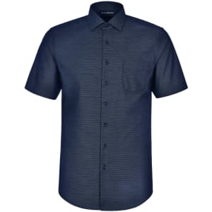 A short-sleeved button-up shirt in navy with a pin dot pattern and a chest pocket. Features branding on the collar.