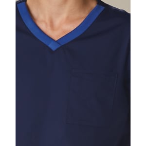 Men's short-sleeve scrub top in navy, featuring a contrast blue neckline and a front pocket. Includes a logo.