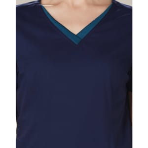 A navy scrub top featuring a contrasting teal V-neck collar and short sleeves. It has a logo on the front.
