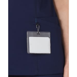 A navy scrub top with a pocket and a badge holder attached.