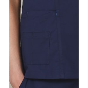 A deep navy scrub top featuring a pocket detail and contrast stitching. Includes a small logo on the garment.