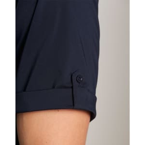 A close-up of a navy men's short sleeve military shirt featuring a buttoned cuff detail.