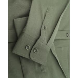 A green cotton blend long-sleeve shirt featuring buttoned cuffs and a logo.