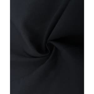 A close-up of dark fabric, showcasing the texture of a cotton blend material in black.
