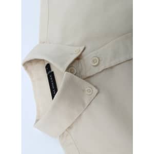 A beige ladies' smart casual cotton blend long sleeve shirt with a folded collar and buttons.