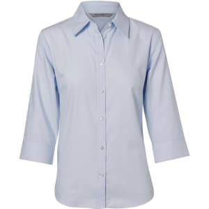 A light blue women's button-up shirt with 3/4 sleeves and a herringbone pattern, featuring a logo on the label.
