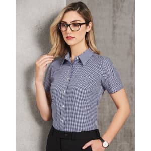 A short-sleeved button-up shirt in a two-tone check pattern, featuring a collar and fitted silhouette.