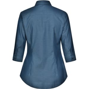 A women's button-up shirt in a blue pin dot pattern, featuring a 3/4 sleeve and a curved hem. It has a logo.