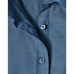 A close-up of a blue pin dot stretch 3/4 sleeve shirt featuring buttons and a fabric texture.