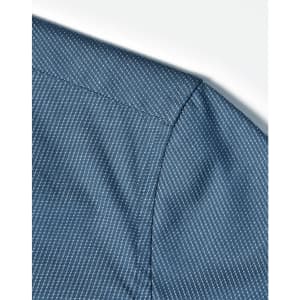 A close-up of a blue pin dot pattern on a 3/4 sleeve shirt, featuring a button-up design.