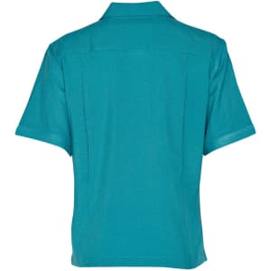 A teal short sleeve overblouse with a collared neck and back pleats, featuring a logo.