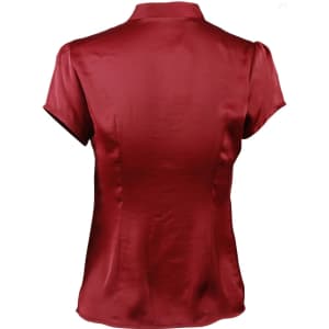 A women's tie neck blouse in a rich maroon colour with short sleeves and a smooth satin finish.