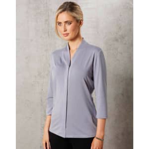 A light grey mid-sleeve knit top featuring a stylish V-neck design and a fitted silhouette. It has a logo on it.
