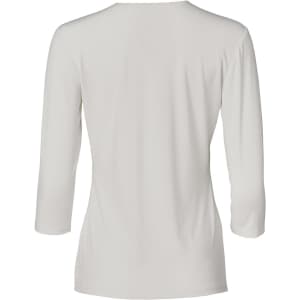 A light grey, mid sleeve knit top with a sleek back design. The shirt features a small logo.