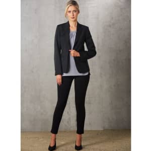 A light grey ladies' round neck top with pleats, paired with a black blazer and black trousers.