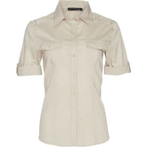 A women's short sleeve military shirt in a beige colour, featuring two front pockets and a logo on the collar.