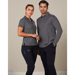 A man and woman wearing grey polo shirts and black cargo pants. The cargo pants have pockets and a logo.