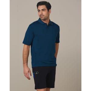 Men's utility cargo shorts in black, featuring pockets and a logo, paired with a navy polo shirt.