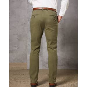 Men's chinos in olive green, featuring a slim fit and back pockets, paired with a brown belt.