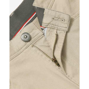 Men's flexi chino pants in beige, featuring a zip fly and button closure, with a logo on the waistband.