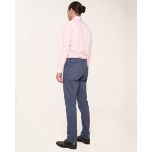 Men's flexi chino pants in navy, paired with a light pink shirt. The back view showcases the fit and design.