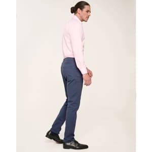 Men's flexi chino pants in navy, styled with a light pink shirt and black shoes, featuring a sleek fit.