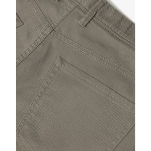 A close-up of men's flexi chino pants in a light brown colour, featuring a back pocket and stitched detailing.
