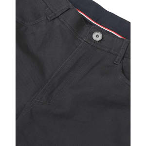 A close-up of black ladies' flexi chino pants, featuring a button and zip fly, with a hint of red and white detailing.