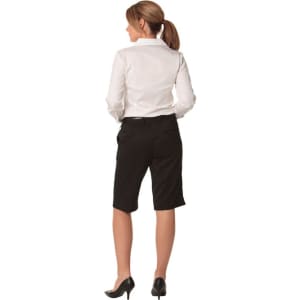 Knee-length black shorts with a flexi waist, shown from the back, paired with a white collared shirt.