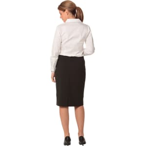 A black mid-length lined pencil skirt made from poly/viscose stretch, paired with a white shirt.