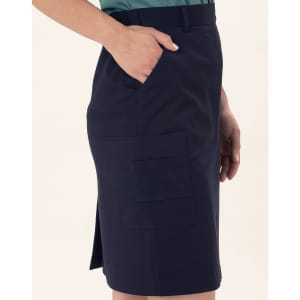 A navy utility cargo skirt with side pockets and a side slit. The fabric is smooth and structured.