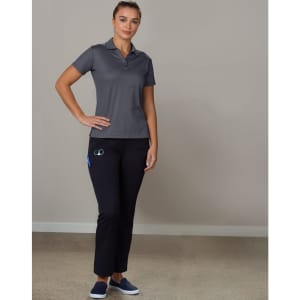 Ladies' utility cargo pants in black, paired with a grey polo shirt, displayed on a model standing against a plain background.