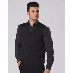 A men's black 100% Merino wool V-neck vest worn over a dark shirt, featuring a fitted design.